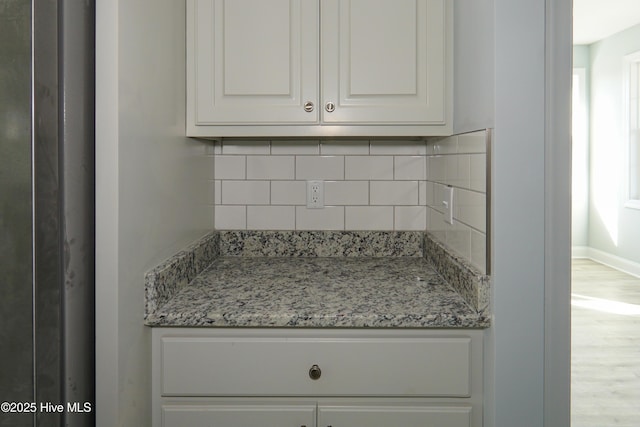 244 Grandview Dr, Sneads Ferry, NC 28460 - room details featuring backsplash, wood finished floors, and baseboards