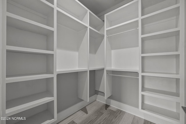 walk in closet featuring hardwood / wood-style floors