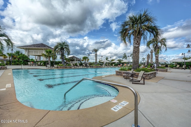 view of pool featuring a patio