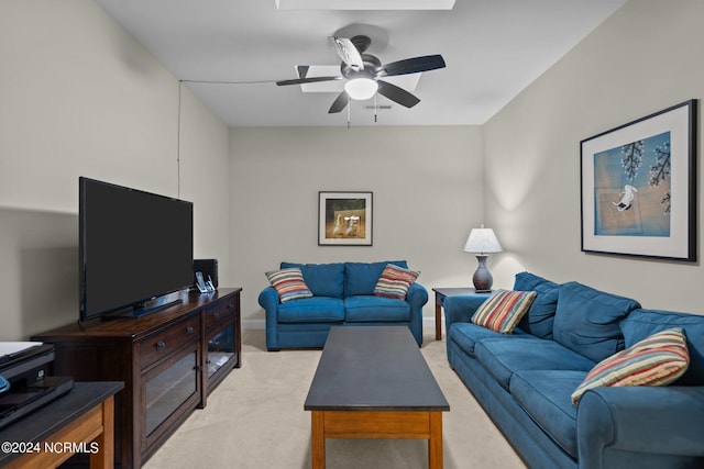 carpeted living room featuring ceiling fan