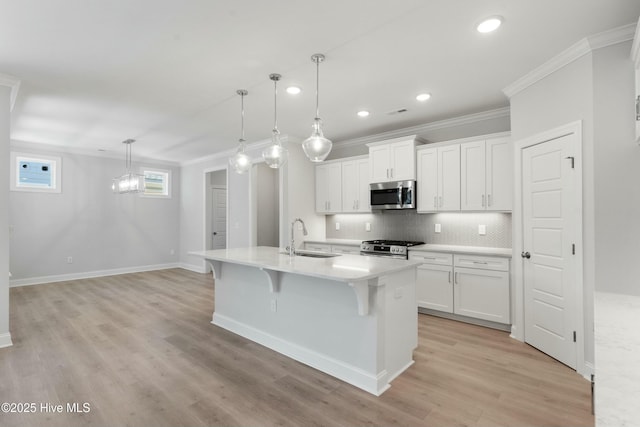 kitchen featuring white cabinetry, stainless steel appliances, and sink