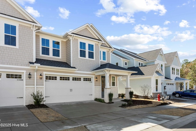 townhome / multi-family property featuring a garage