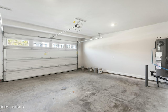 garage with a garage door opener and water heater