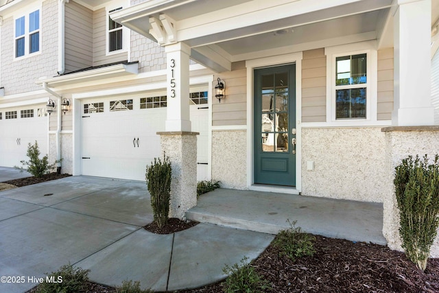 view of exterior entry featuring a garage