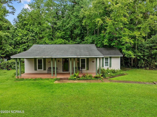 single story home with a porch and a front yard