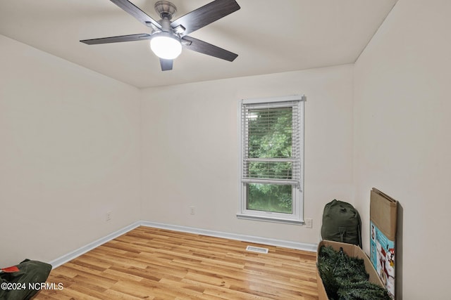 spare room featuring ceiling fan and light hardwood / wood-style flooring