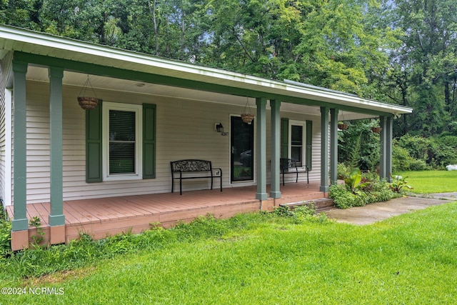 exterior space with a porch and a yard