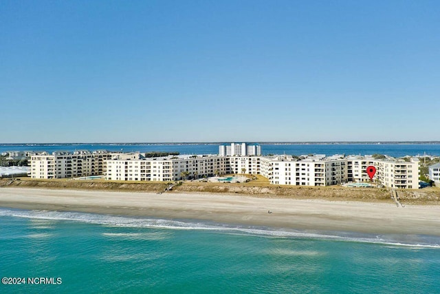 drone / aerial view with a water view and a view of the beach