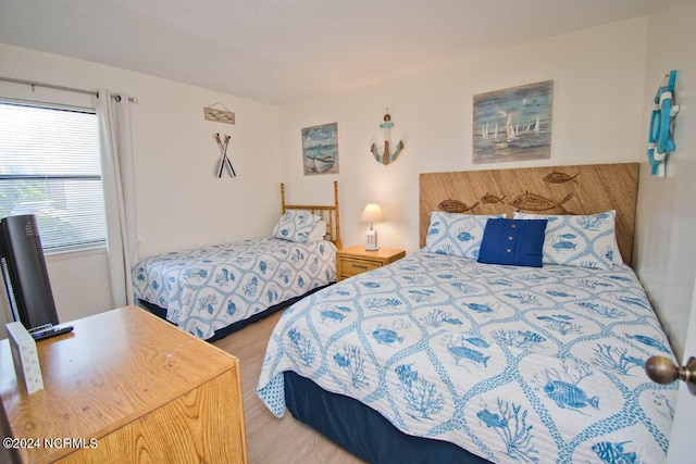 bedroom with wood finished floors