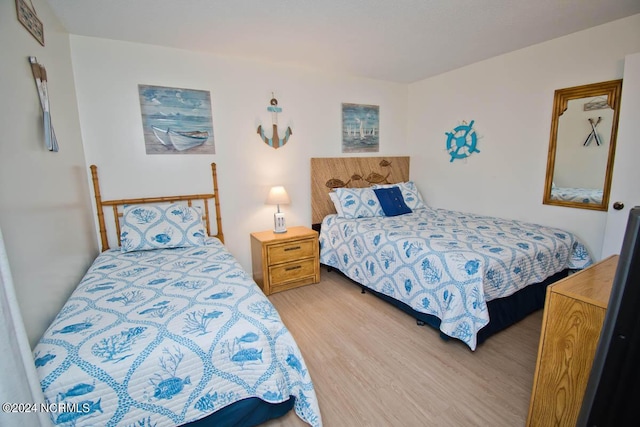 bedroom with light wood-type flooring