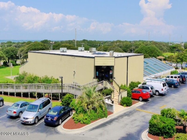 view of property with uncovered parking