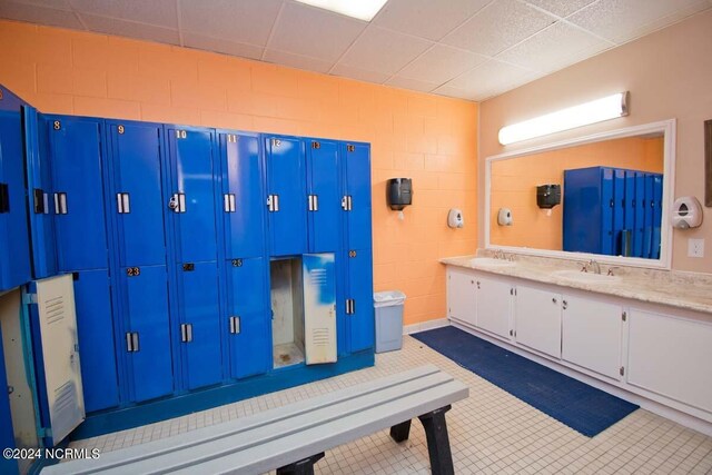 interior space featuring double vanity and a sink