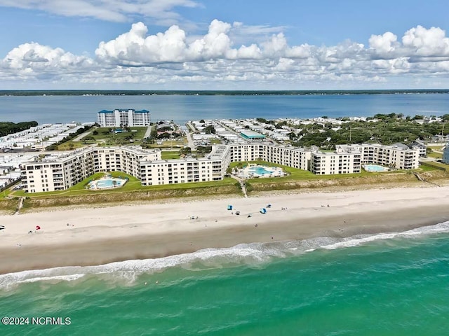 aerial view with a water view and a beach view