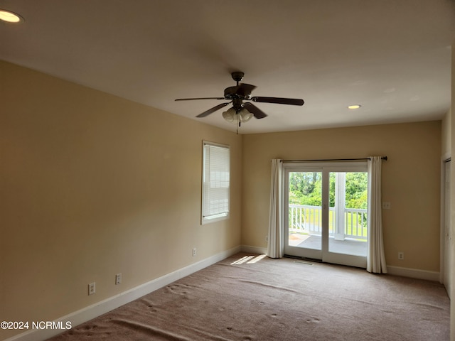 carpeted empty room with ceiling fan