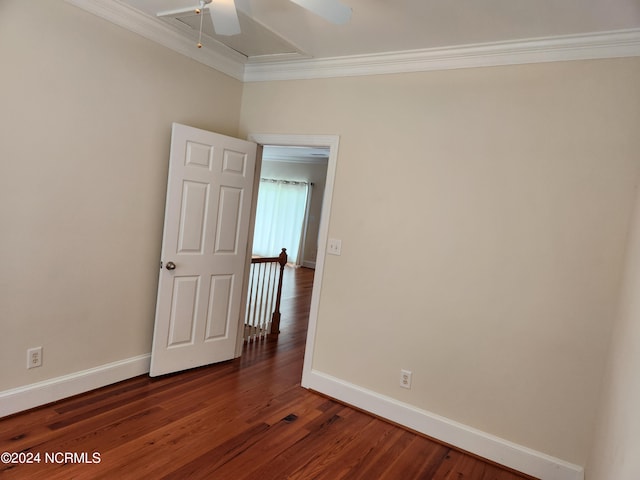 unfurnished room featuring ornamental molding, ceiling fan, and dark hardwood / wood-style flooring