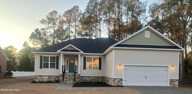 view of front of property featuring concrete driveway