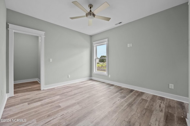 spare room featuring ceiling fan and light hardwood / wood-style floors