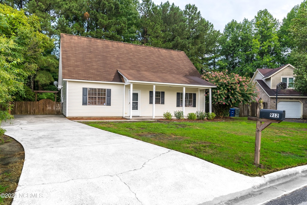 cape cod house with a garage, a porch, and a front lawn