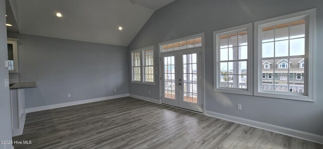 interior space with ceiling fan, light hardwood / wood-style floors, and french doors