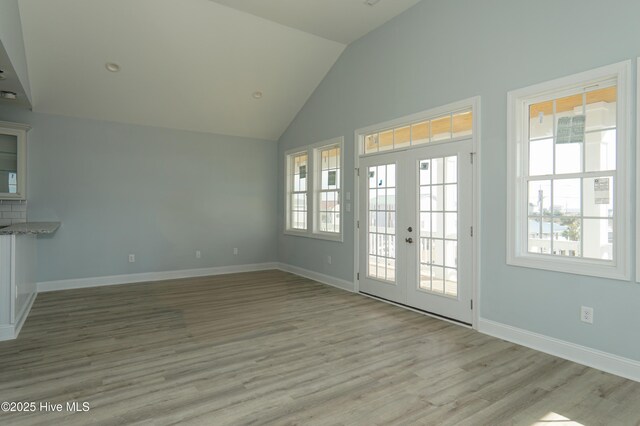 doorway featuring ceiling fan and light hardwood / wood-style flooring