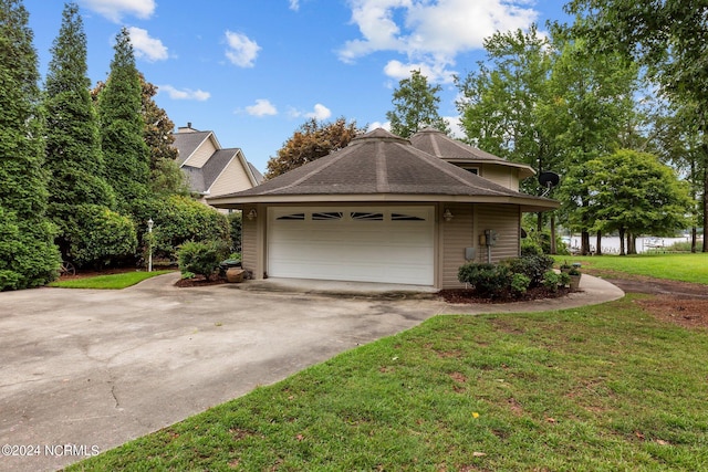 view of front of property with a garage and a front yard