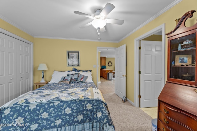 bedroom with ceiling fan, light tile patterned floors, crown molding, and a closet