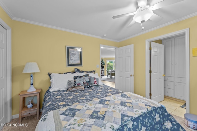 bedroom featuring ceiling fan, light tile patterned flooring, ornamental molding, and a closet