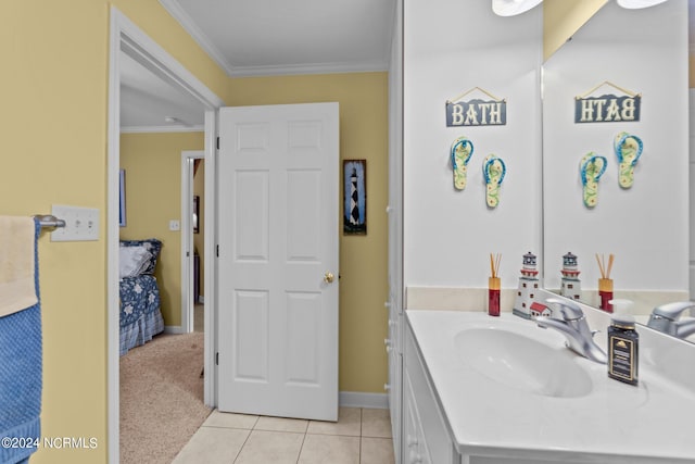 bathroom with crown molding, tile patterned floors, and vanity