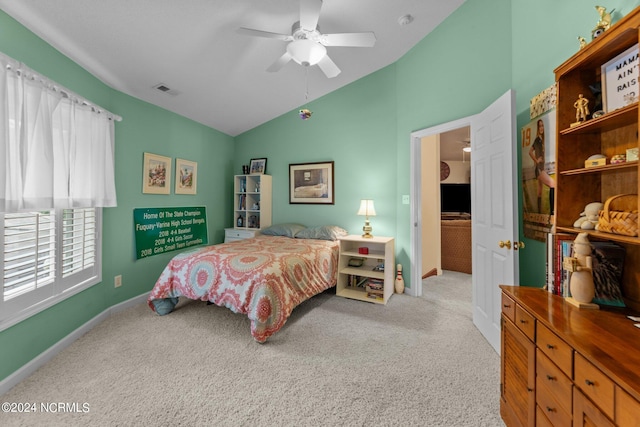 carpeted bedroom with ceiling fan and lofted ceiling