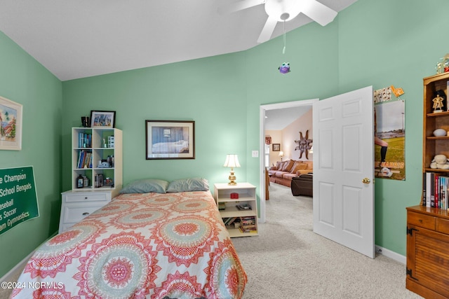 bedroom featuring vaulted ceiling, carpet flooring, a ceiling fan, and baseboards