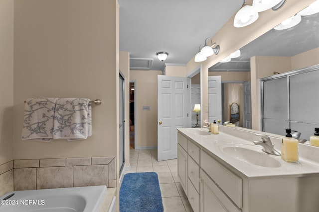 bathroom with plus walk in shower, dual bowl vanity, and tile patterned flooring