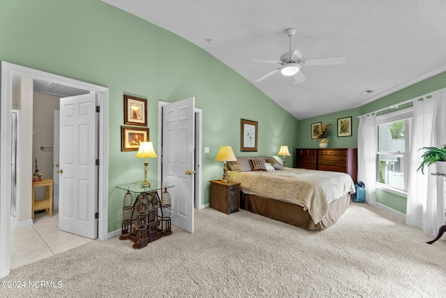 bedroom featuring light carpet, a textured ceiling, lofted ceiling, and ceiling fan