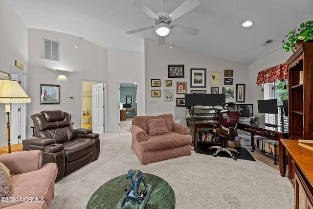 carpeted office space featuring ceiling fan, high vaulted ceiling, and a textured ceiling