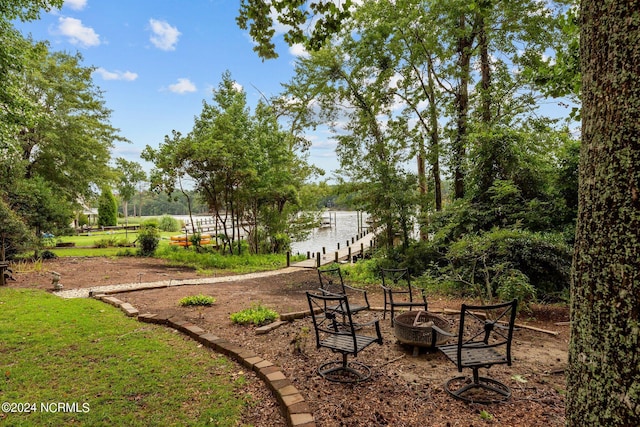 view of home's community with a fire pit