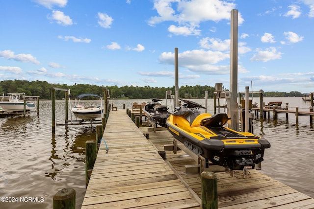 view of dock with a water view and boat lift