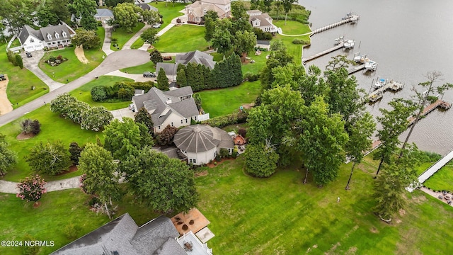 drone / aerial view featuring a water view and a residential view