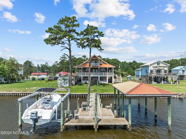 view of dock featuring boat lift, a water view, and a lawn