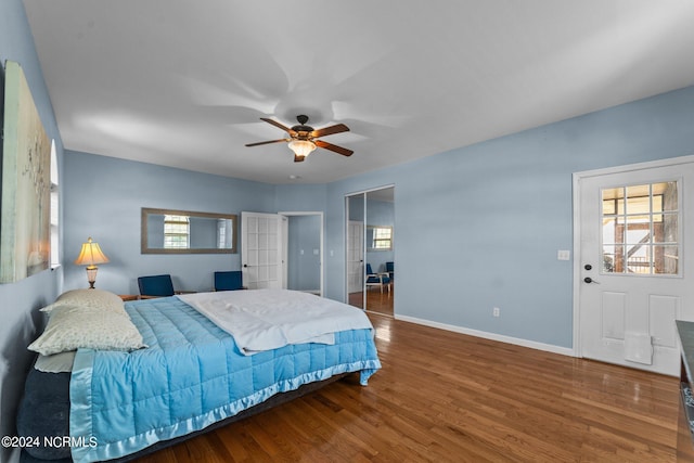 bedroom featuring a closet, hardwood / wood-style floors, and ceiling fan