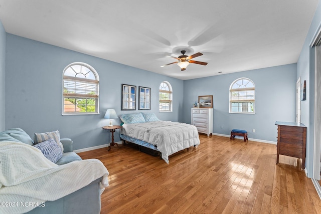 bedroom featuring ceiling fan and hardwood / wood-style floors