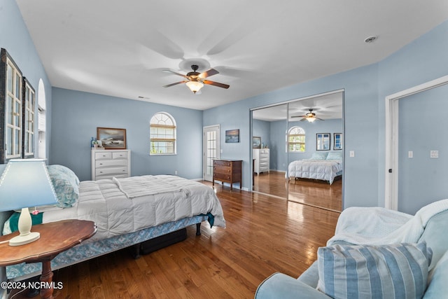 bedroom with ceiling fan, hardwood / wood-style floors, and a closet