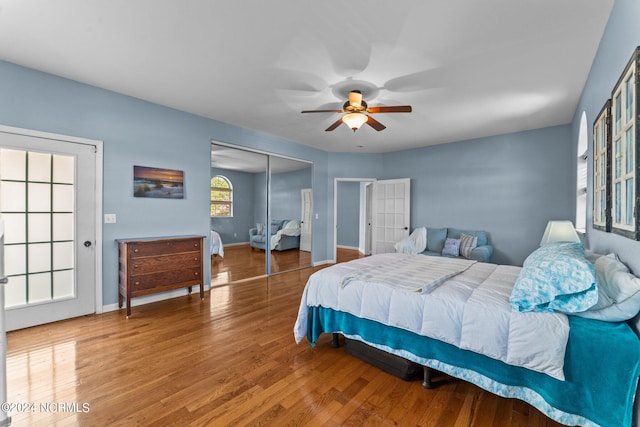 bedroom with a closet, ceiling fan, and hardwood / wood-style floors