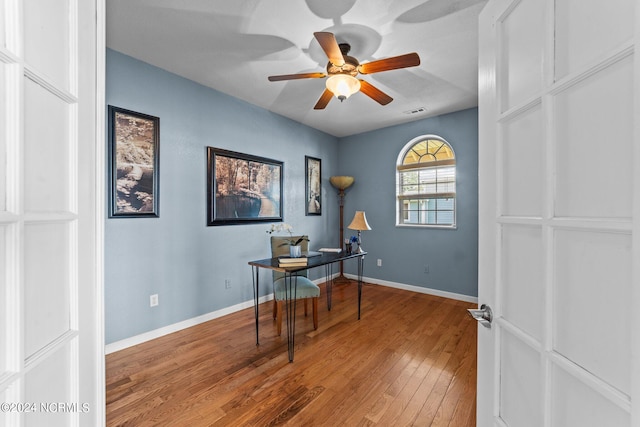 office space featuring hardwood / wood-style flooring and ceiling fan