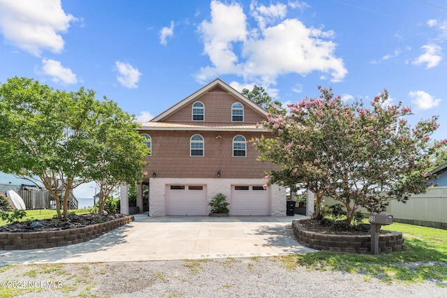 view of front of house with a garage and concrete driveway