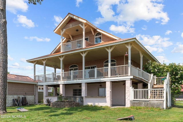 view of front of home featuring a balcony and a front yard