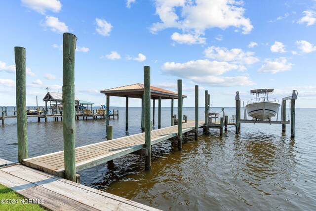 view of dock featuring a water view and boat lift