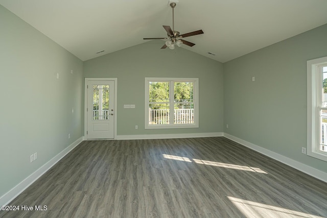 unfurnished living room with ceiling fan, dark hardwood / wood-style floors, and vaulted ceiling