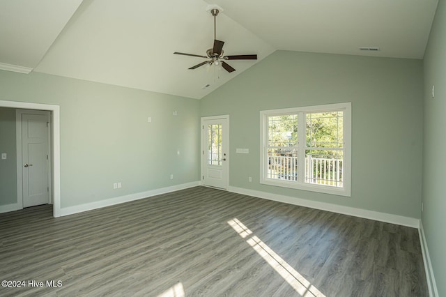 unfurnished living room featuring dark hardwood / wood-style floors, vaulted ceiling, and ceiling fan