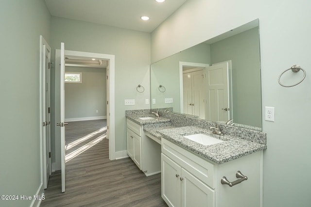 bathroom featuring vanity and hardwood / wood-style flooring