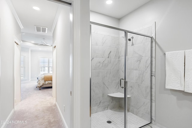 ensuite bathroom with visible vents, baseboards, a shower stall, ensuite bath, and crown molding