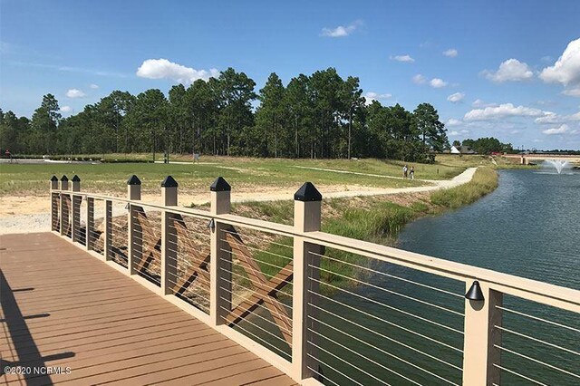 community pool featuring fence and a patio